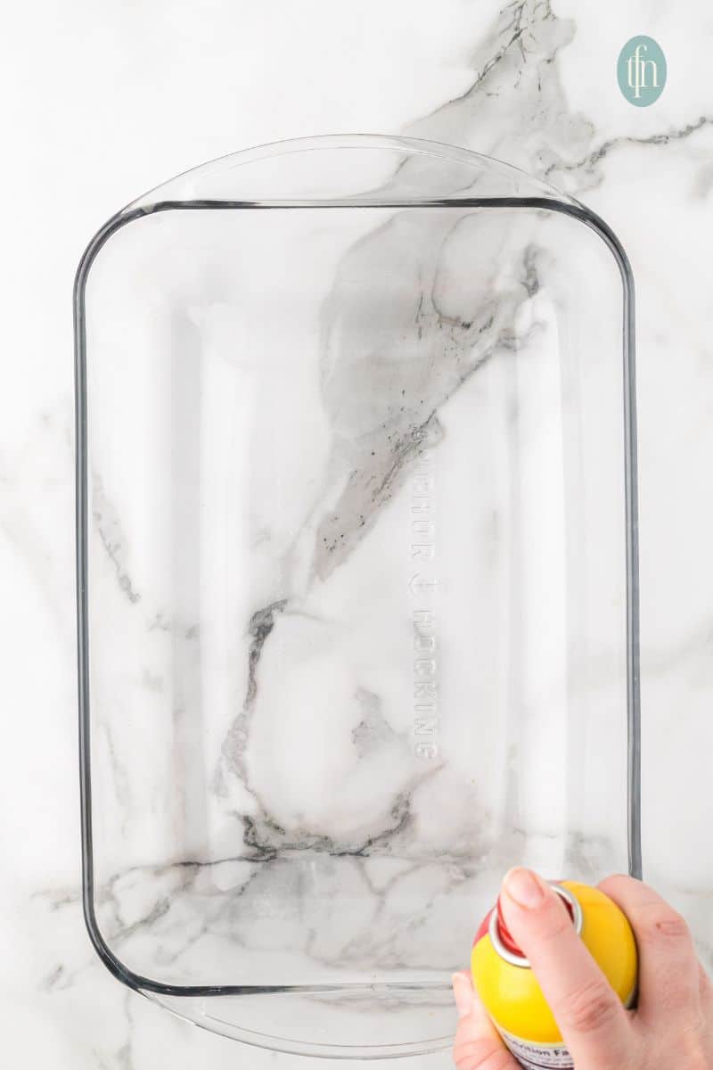 A glass baking pan sprayed with baking oil.