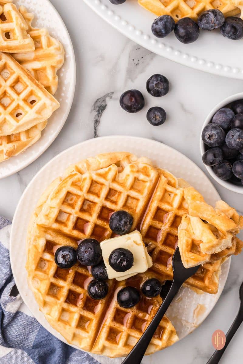 Waffles on a white plate.