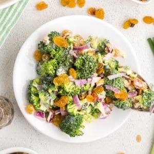 Broccoli salad in a white plate.