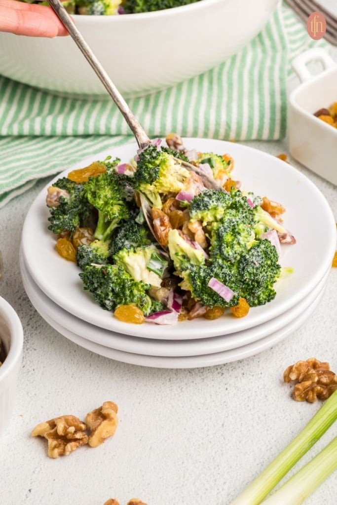 Broccoli salad in a white plate.