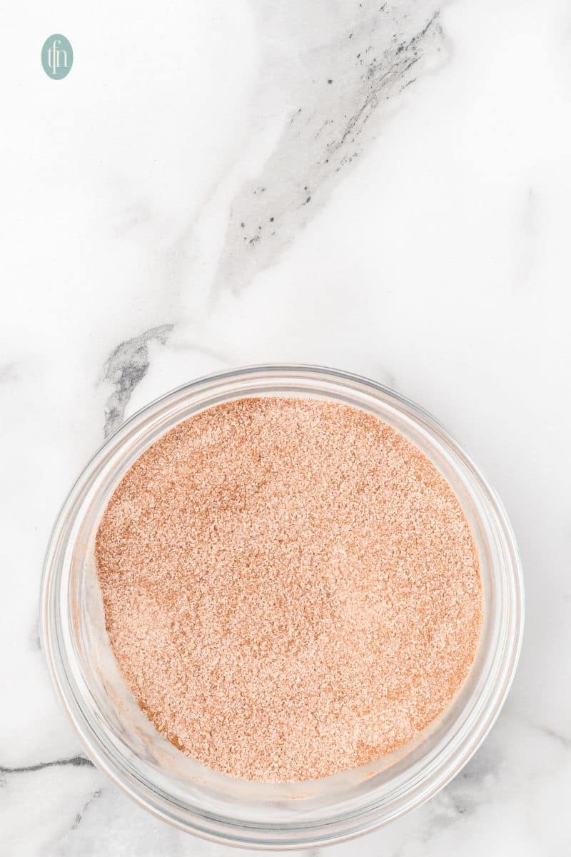 A bowl of cinnamon and sugar mixture.