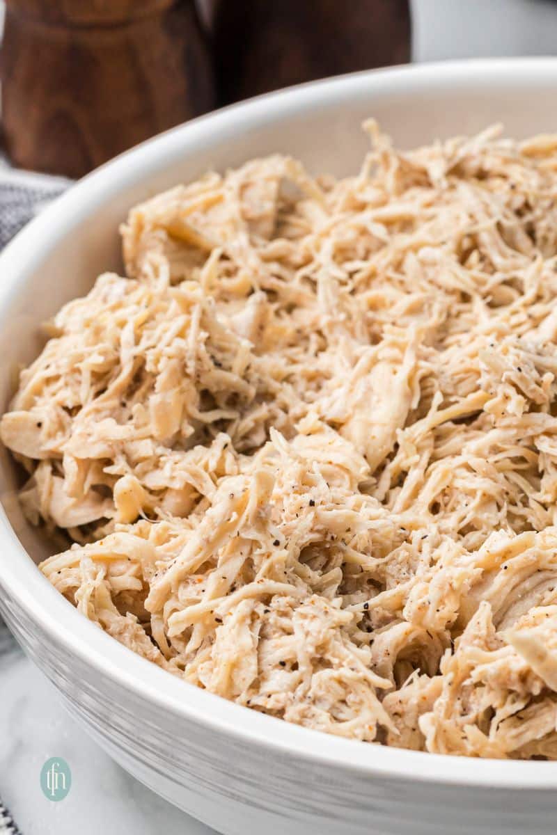 A bowl of shredded chicken.