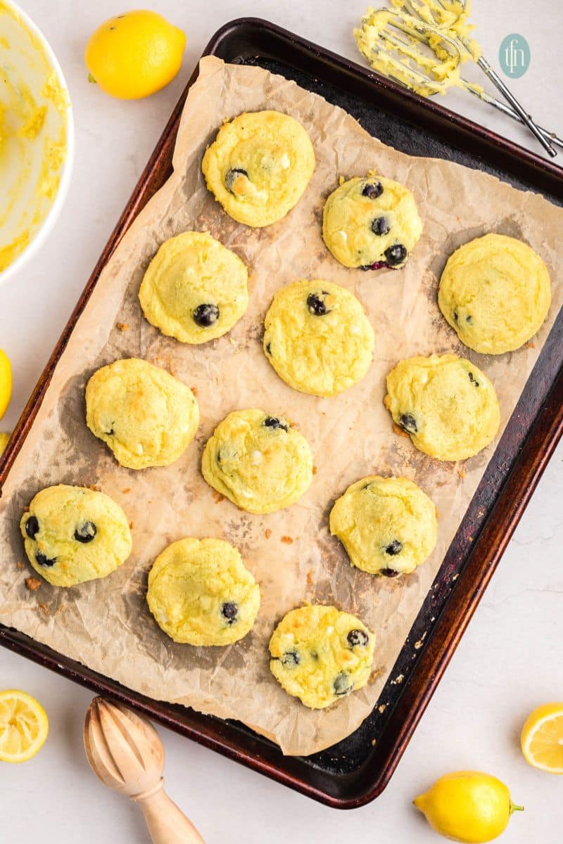 Baked cookies on a baking sheet with parchment paper.