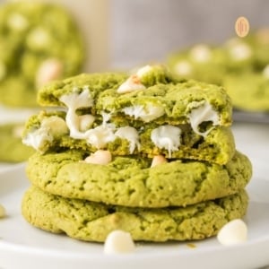 A plate of stacked green cookies.