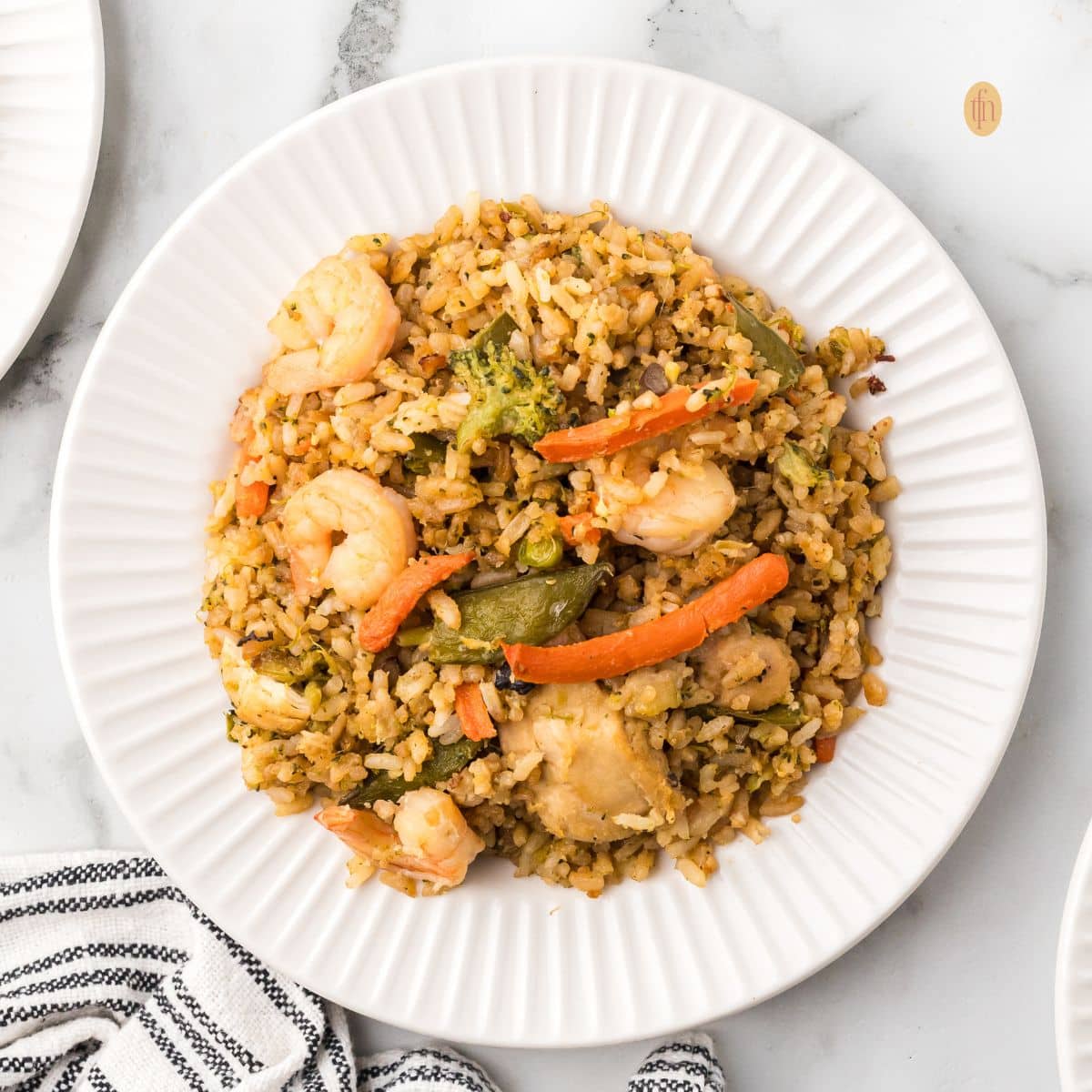 A plate of chicken fried rice.