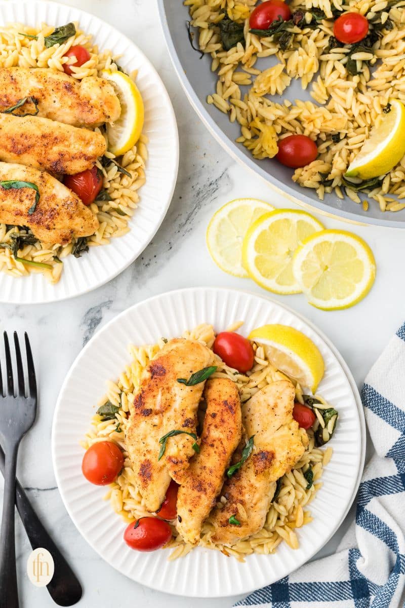 A plate of chicken and orzo.