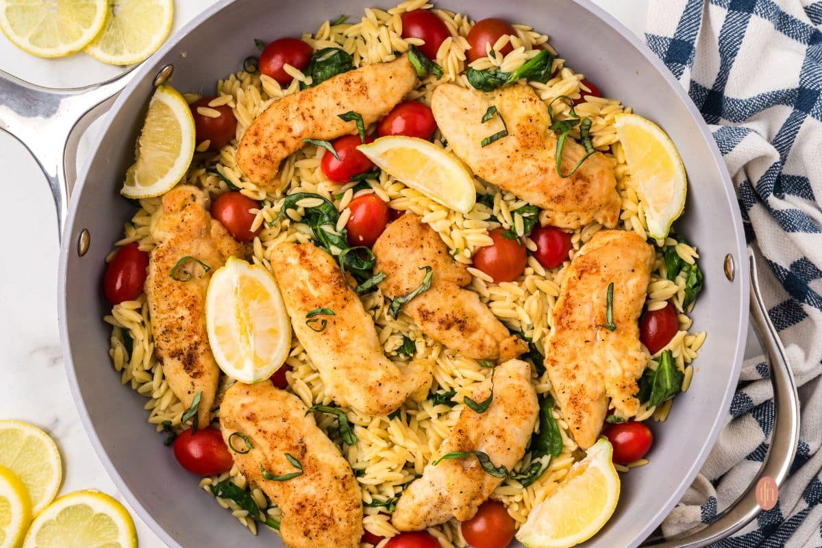 A pan of chicken and orzo.