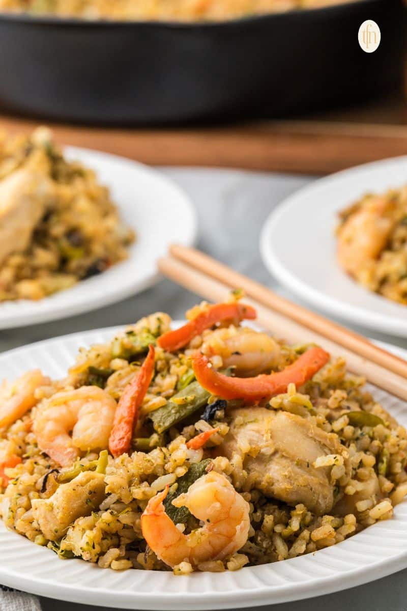 A plate of chicken fried rice.