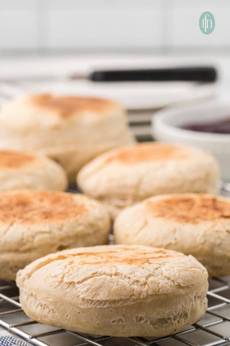 English muffins on a cooling rack.