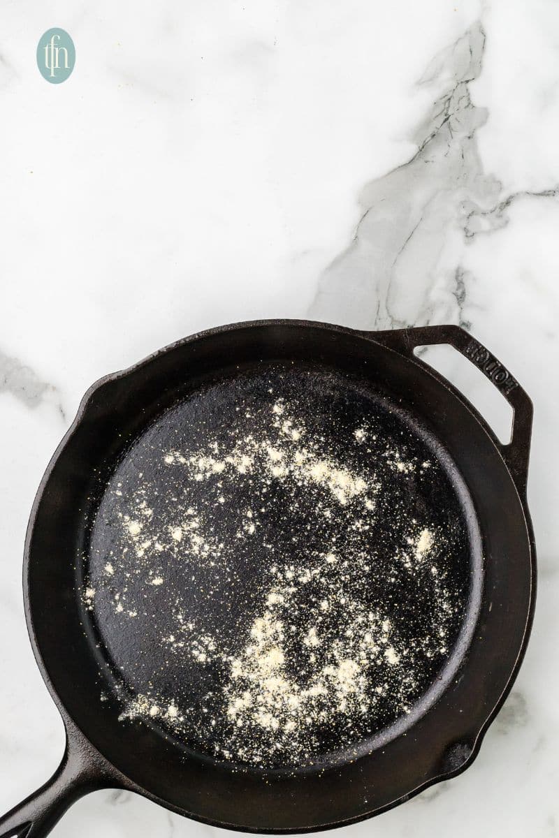 A skillet sprinkled with flour.