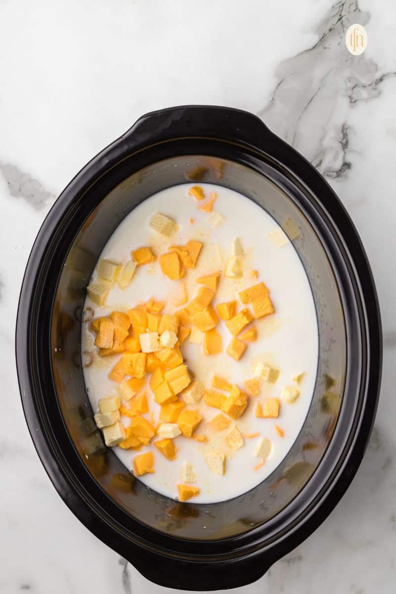 Crockpot with macaroni mixture.