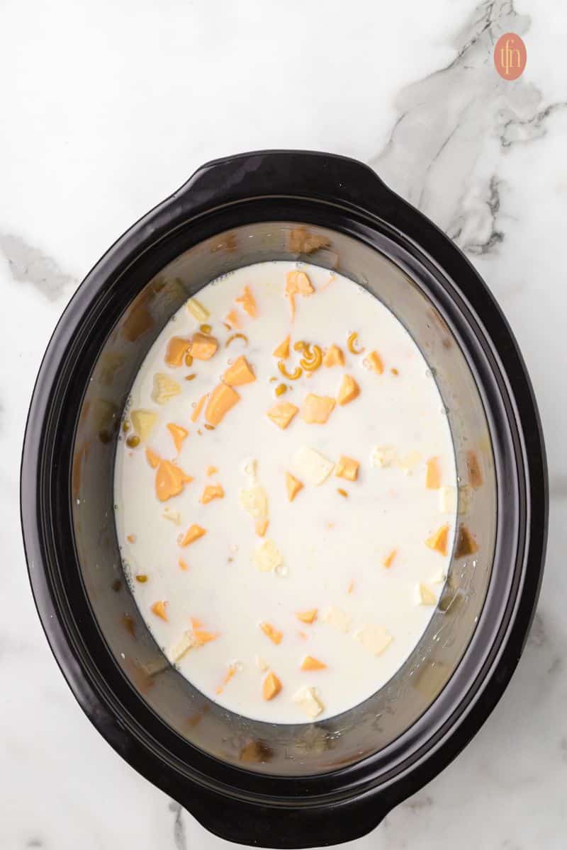 Crockpot with macaroni mixture.