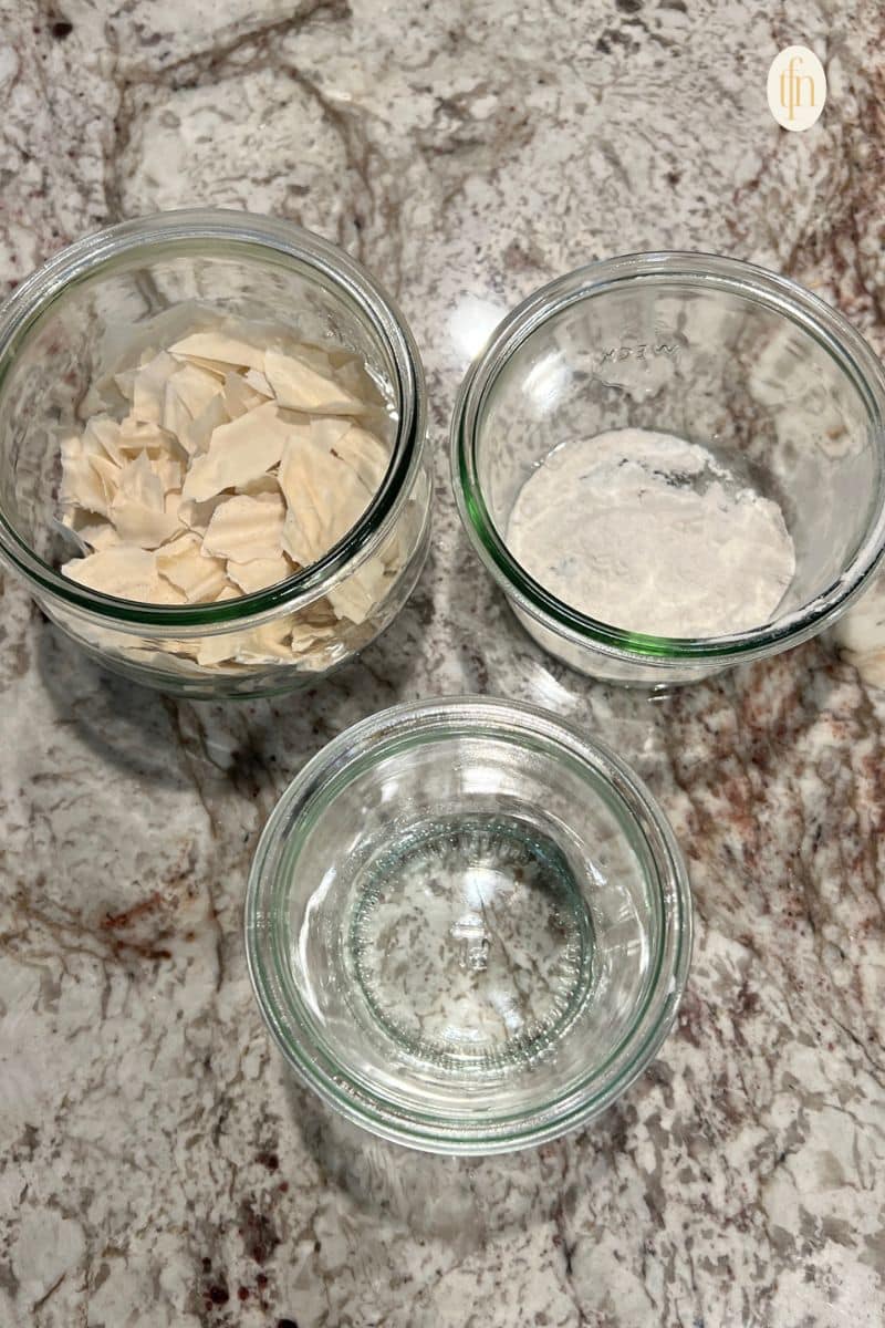 A jar of flour, dehydrated starter, and water.