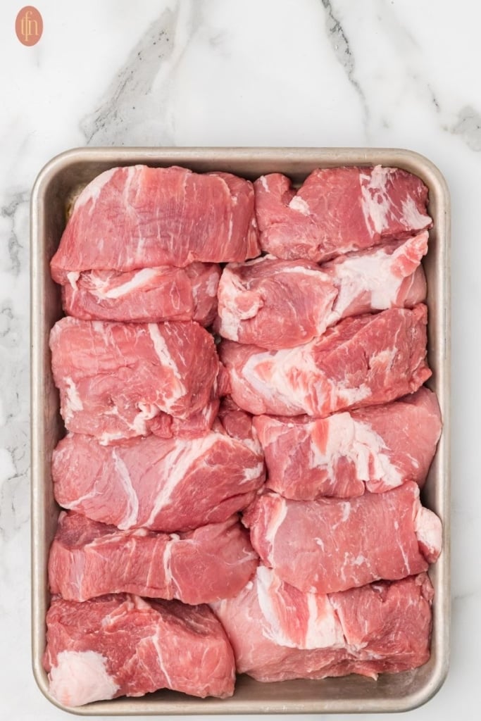 sliced and raw Slow Cooker Country Style Ribs ready to cook.