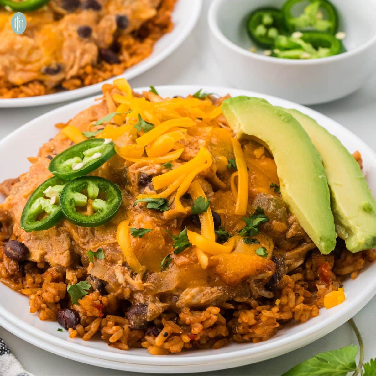 a plate of crockpot chicken enchiladas.