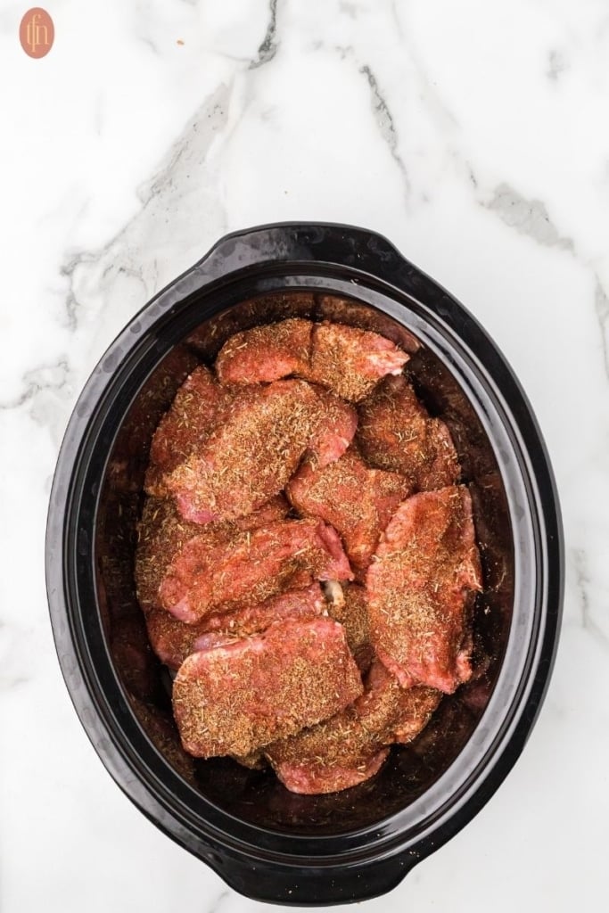 a prep photo showing the ingredients for Boneless pork ribs ready to cook in slow cooker.