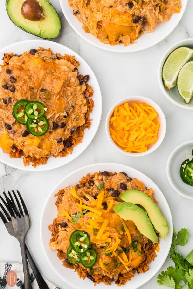 two plate of chicken slow cooker enchiladas.