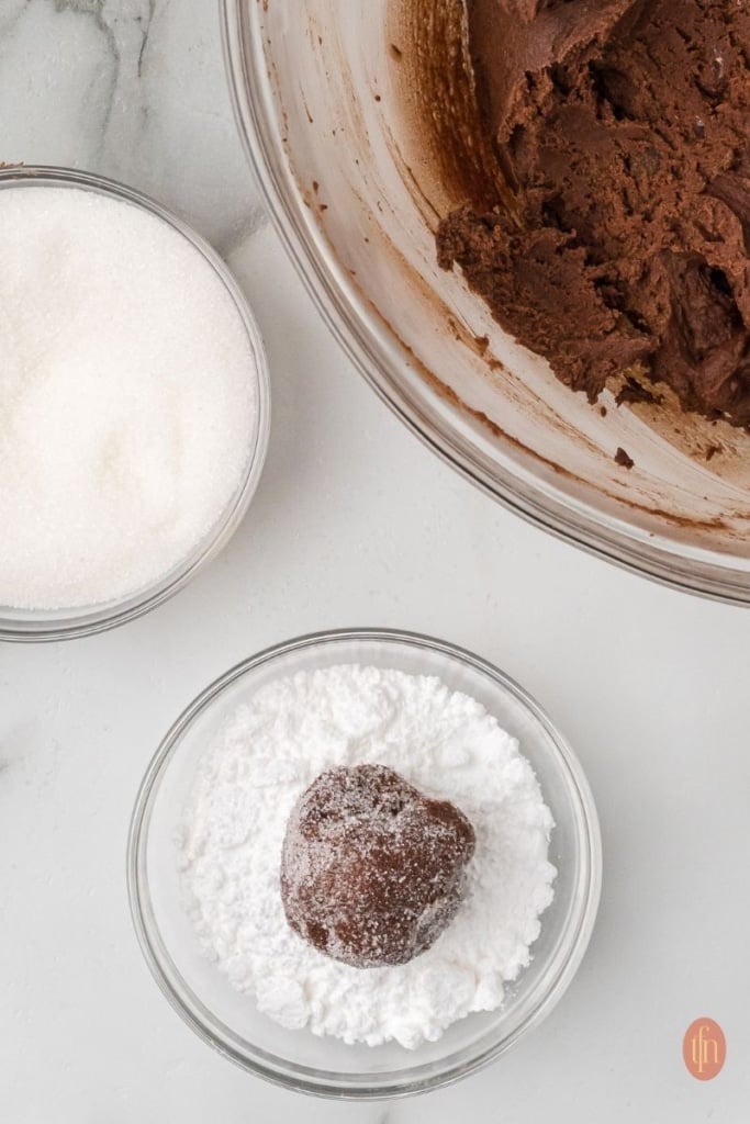 a bowl of coated dough ball.