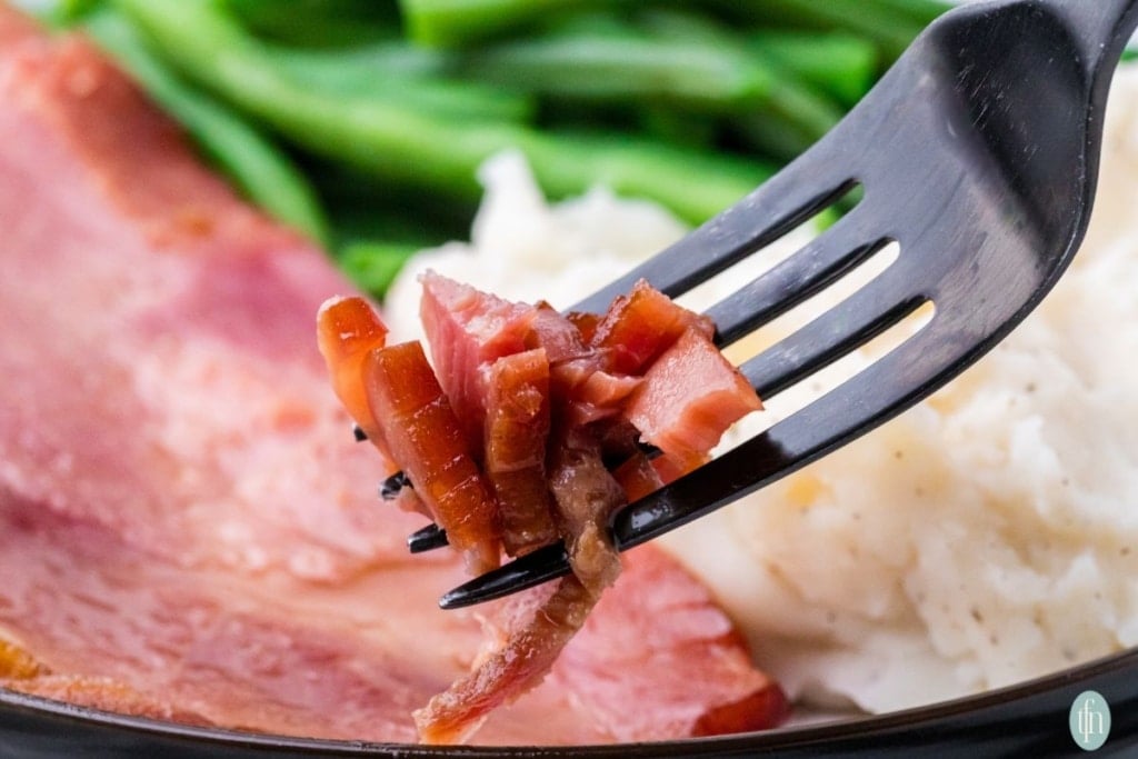 cola ham on a fork.