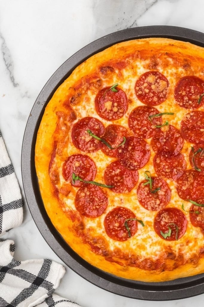 a pizza with pepperonis on top.