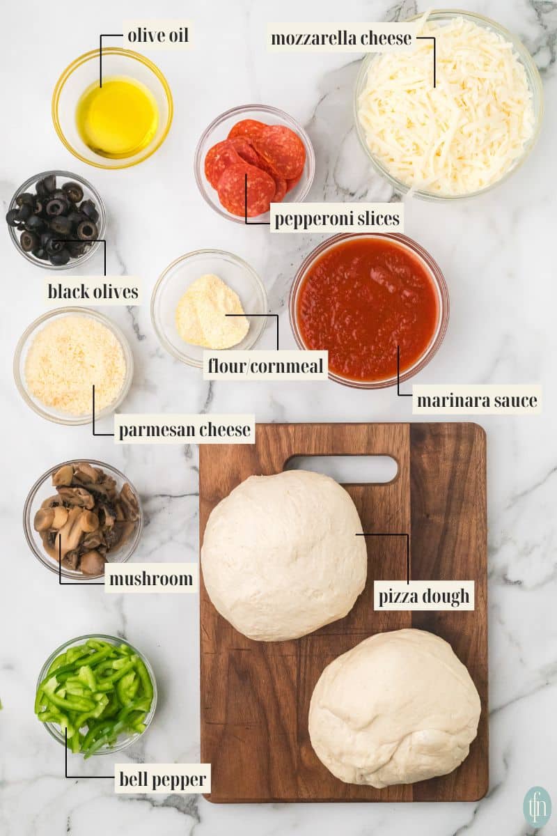 a graphic image of labeled ingredients for homemade pizza: olive oil, mozzarella cheese, parmesan cheese, cornmeal, marinara sauce, pizza dough, pepperoni slices, black olives, parmesan cheese, mushroom, and bell pepper.