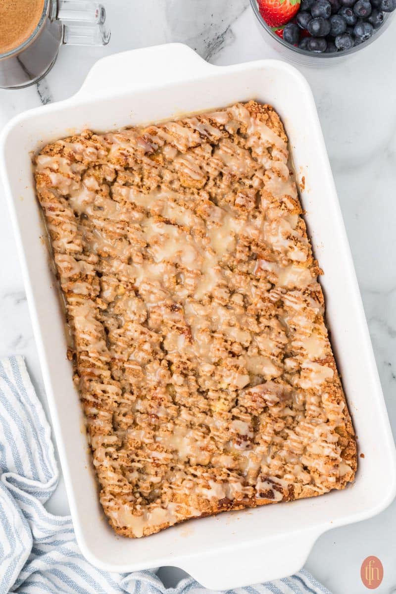 brioche french toast in a white casserole.