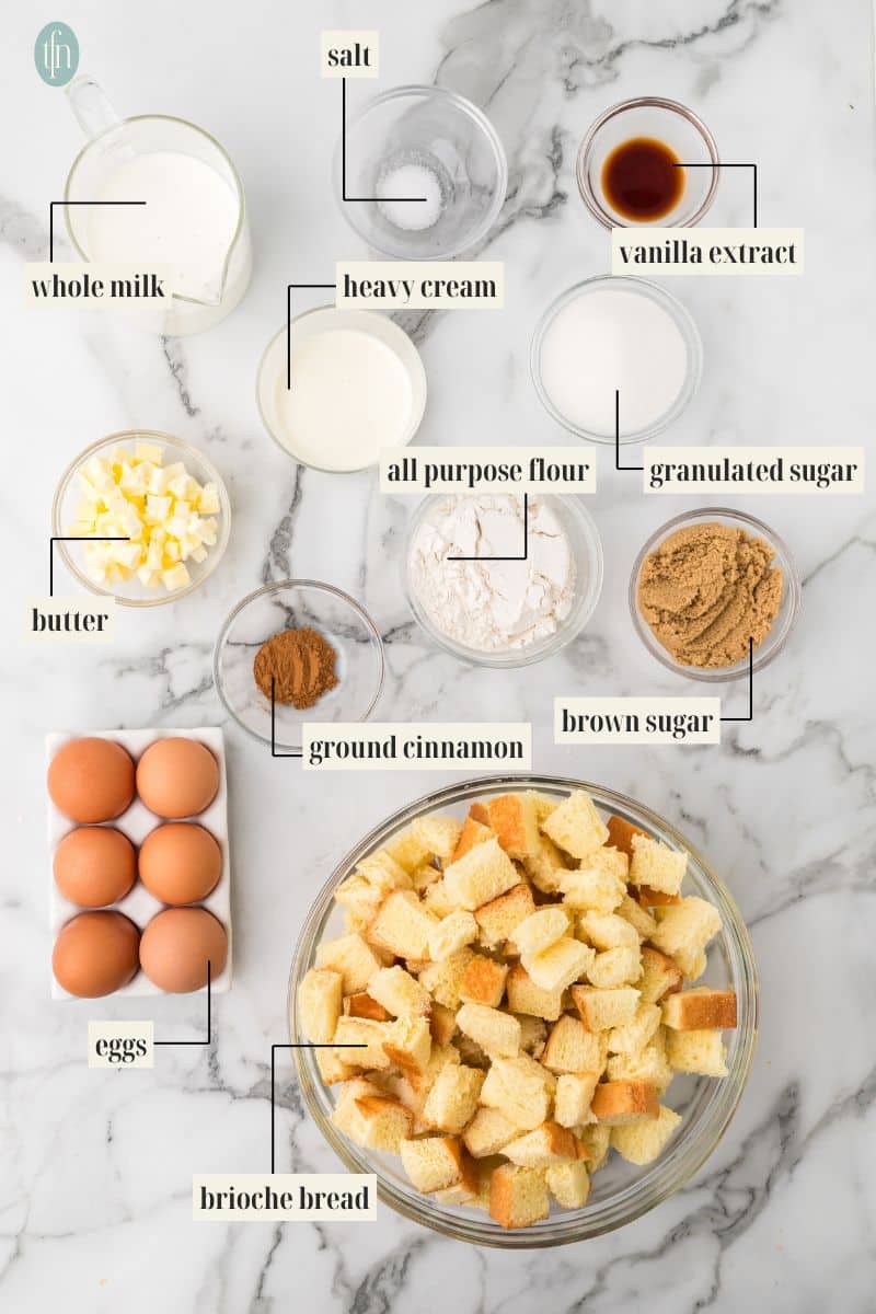 brioche french toast casserole Ingredient Image: whole milk, salt, heavy cream, vanilla extract, butter, all purpose flour, granulated sugar, ground cinnamon, brown sugar, eggs, and brioche bread.