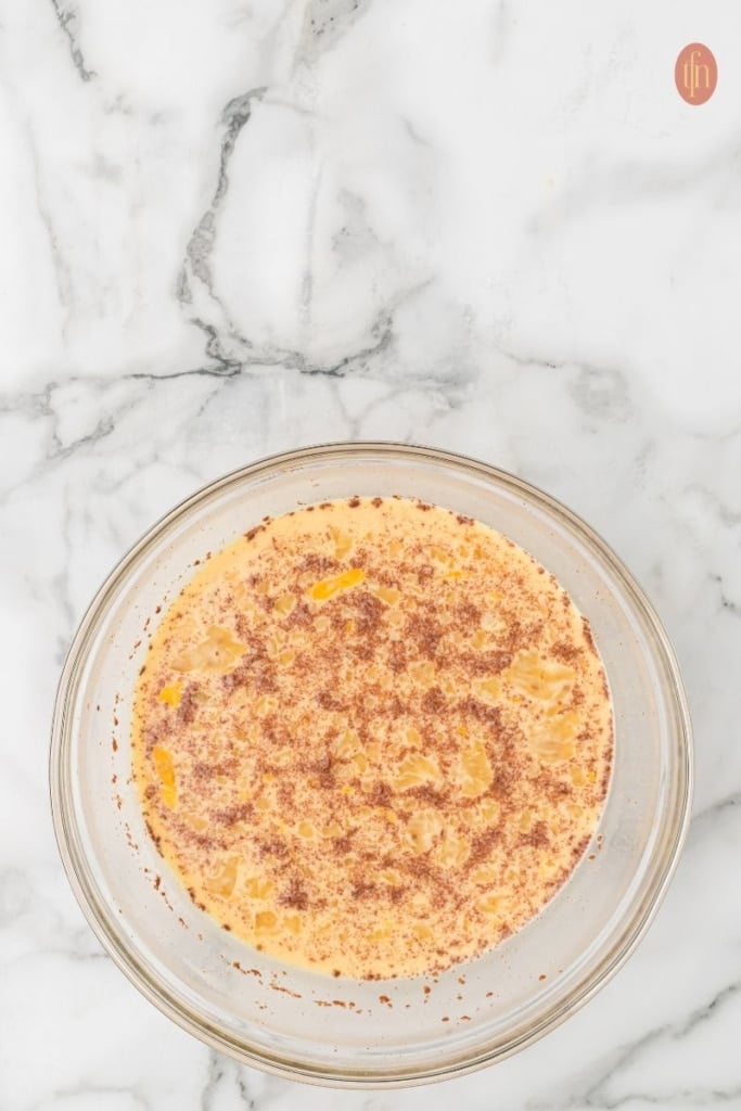 a bowl of brioche casserole ingredients.