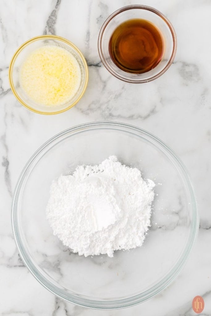 a bowl of all purpose flour, olive oil and butter.