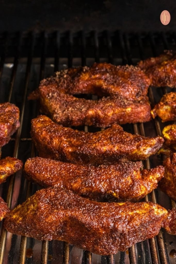 smoked party ribs on a grill.