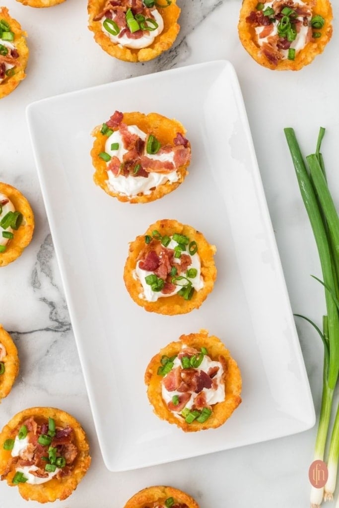 an image of a Loaded Tater Tot Cups on a rectangular plate.