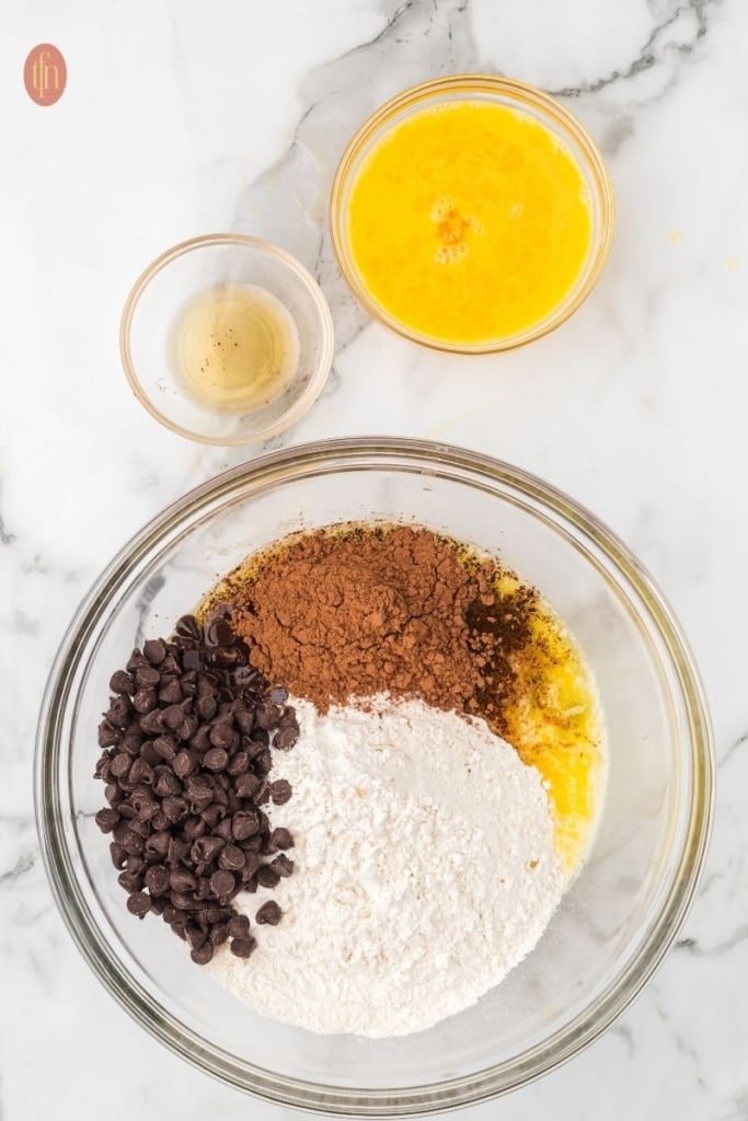homemade brownie ingredients in a clear glass bowl.