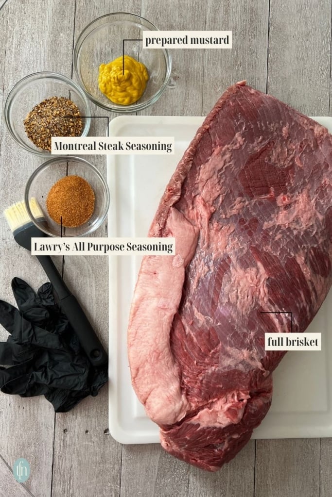 smoked brisket Ingredient Image: prepared mustard, Montreal Steak Seasoning, Lawry's all purpose seasoning, and full brisket.