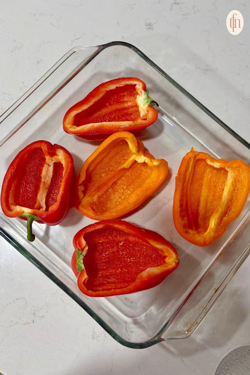 bell peppers on a clear square bowl.