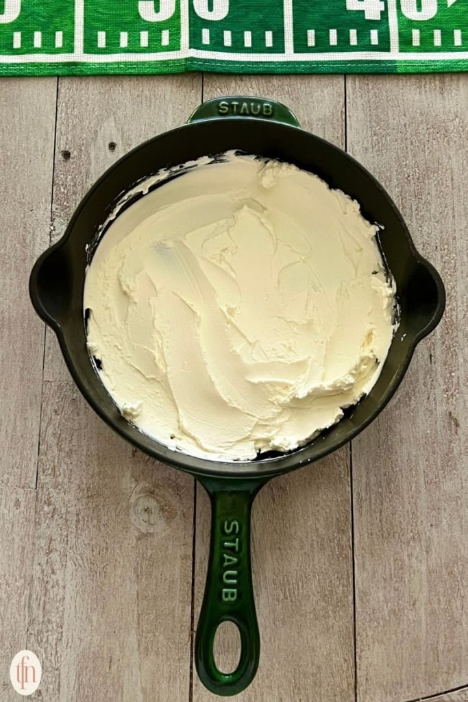creamy cheese spread in a skillet.
